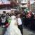 عکس: شرکت در راهپیمایی با لباس عروسی
