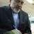 ظریف در حال امضای "آقای سفیر"/عکس